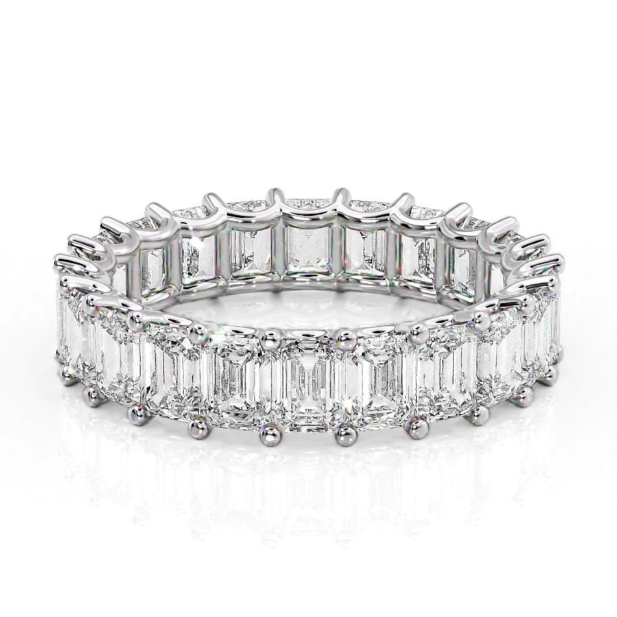 5.5ct Emerald U Prong Eternity. A White Gold Eternity Ring Set With 5.5tcw Emerald Lab Grown Diamonds. White Background.