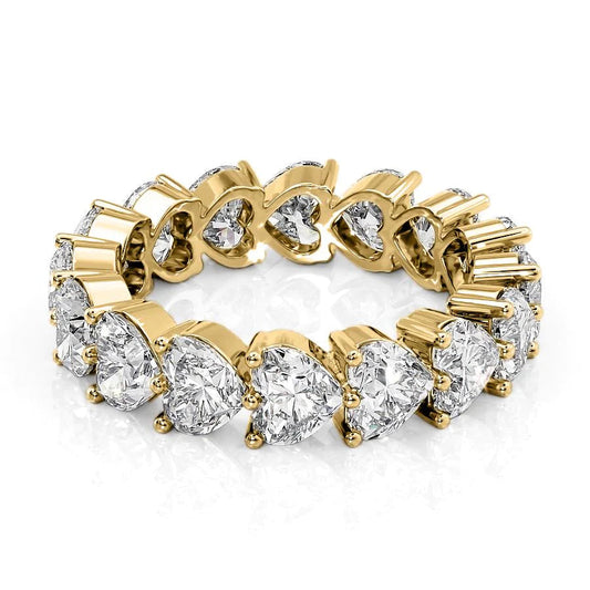 5.5ct Heart Shared Prong Eternity. A Yellow Gold Eternity Ring Set With 5.5tcw Heart Lab Grown Diamonds. White Background.