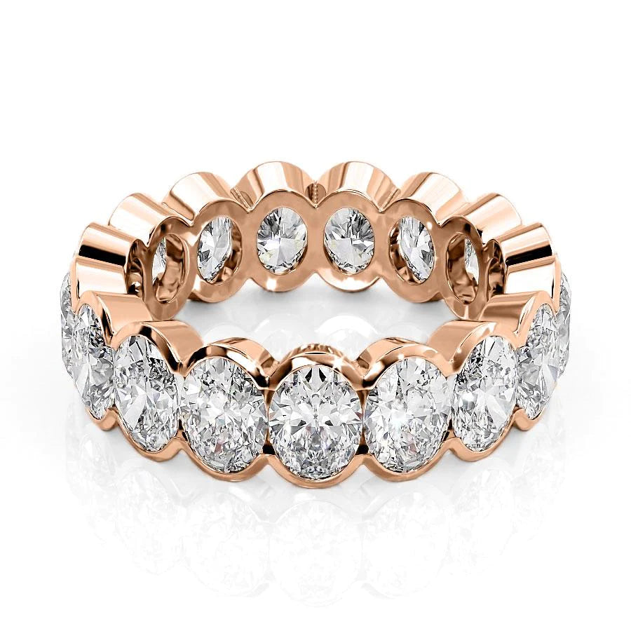 5.5ct Oval Half Bezel Eternity. A Rose Gold Eternity Ring Set With 5.5tcw Oval Lab Grown Diamonds. White Background.