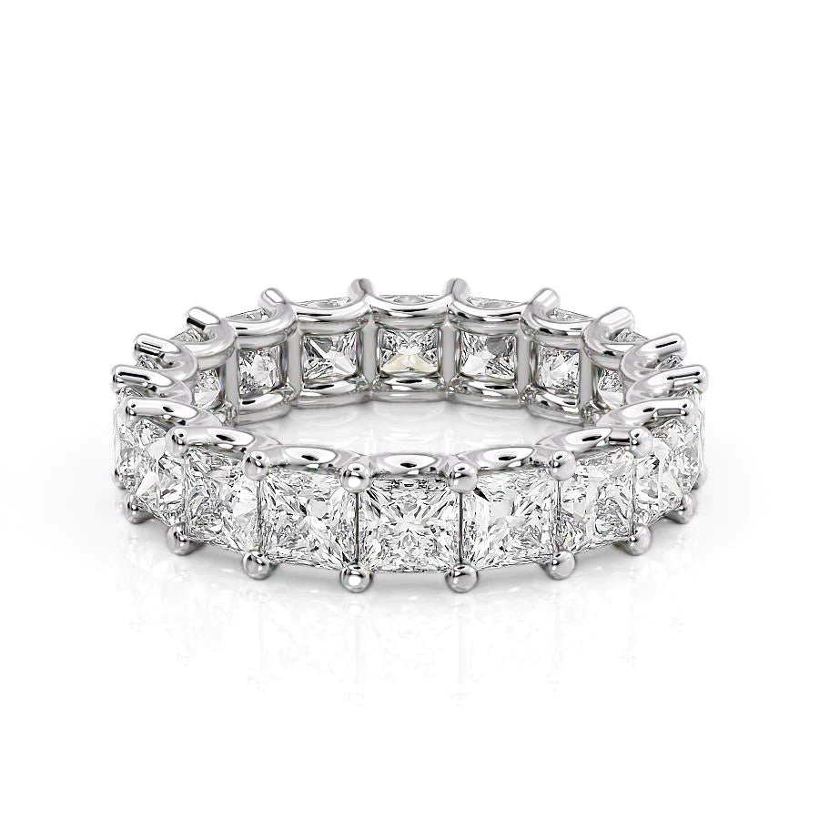 5.5ct Princess U Prong Eternity. A White Gold Eternity Ring Set With 5.5tcw Princess Lab Grown Diamonds. White Background.