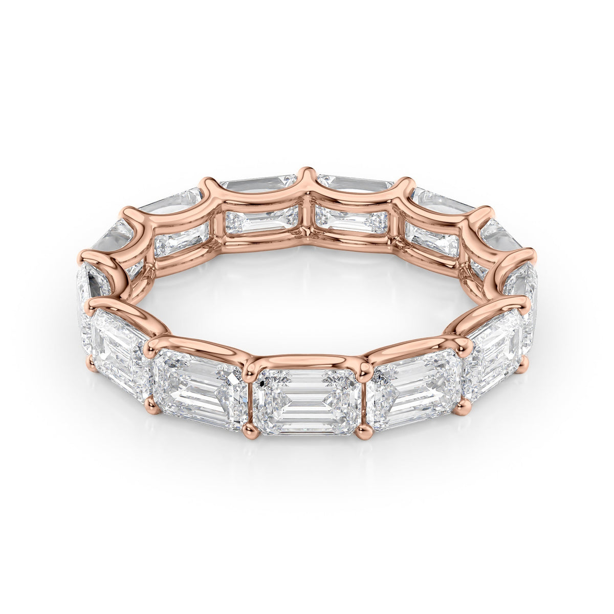 5ct East West Emerald U Prong Eternity. A Rose Gold Eternity Ring Set With 5tcw Emerald Lab Grown Diamonds. White Background.