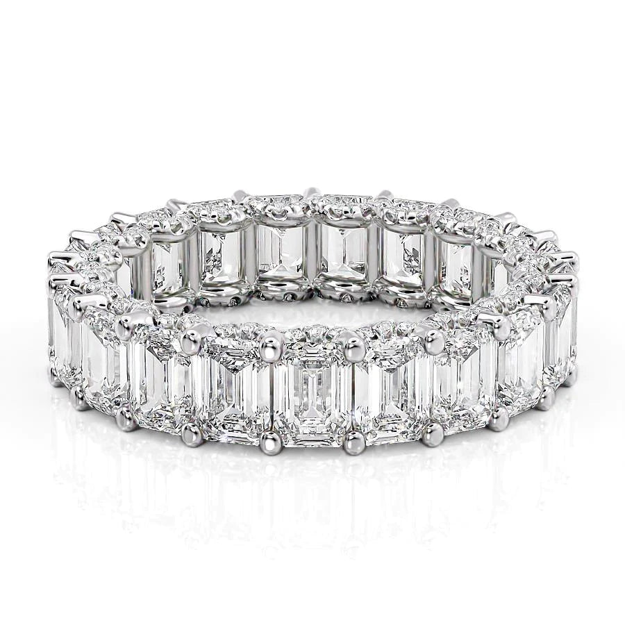 6.3ct Emerald U Pave Prong Eternity. A White Gold Eternity Ring Set With 6tcw Emerald Lab Grown Diamonds. White Background.