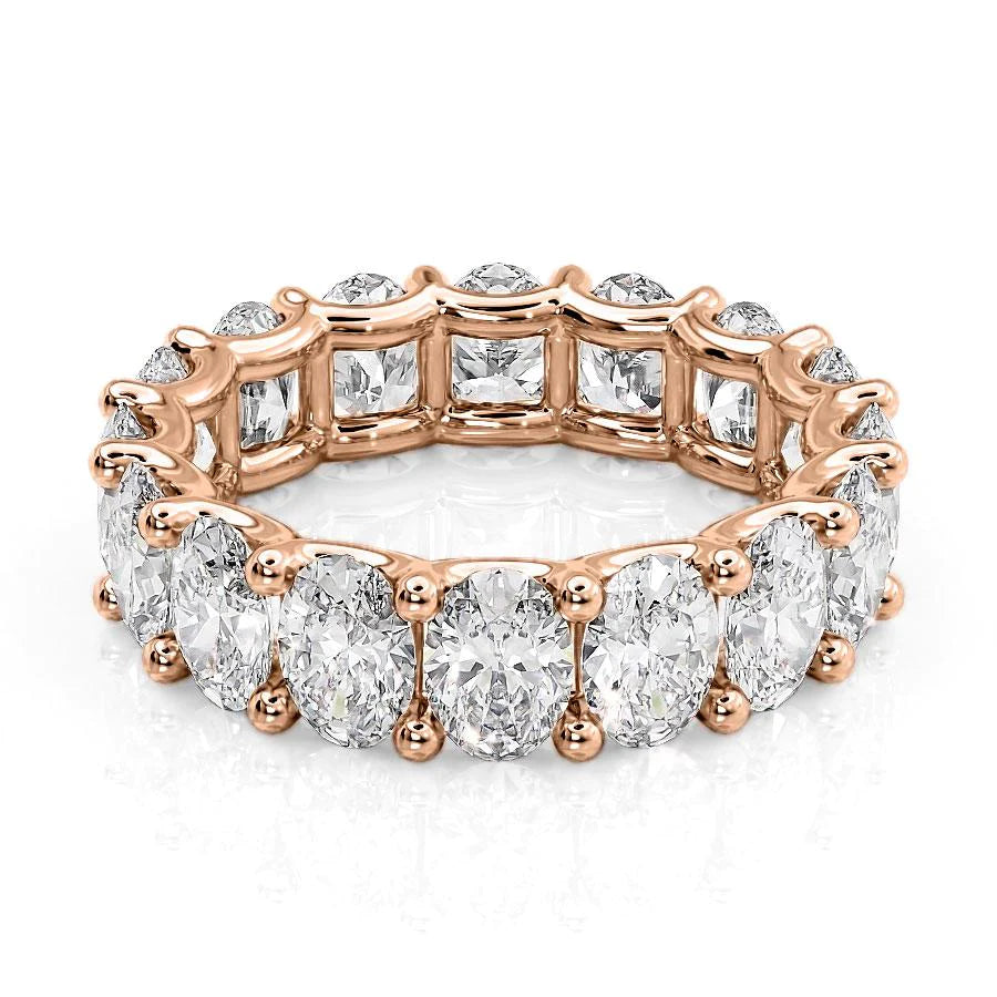 6.5ct Oval U Prong Eternity. A Rose Gold Eternity Ring Set With 6.5tcw Oval Lab Grown Diamonds. White Background.