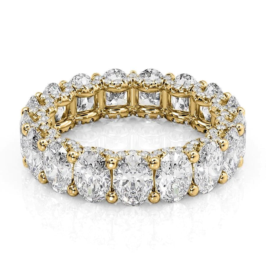 6.8ct Oval U Pave Prong Eternity. A Yellow Gold Eternity Ring Set With 6.5tcw Oval Lab Grown Diamonds. White Background.