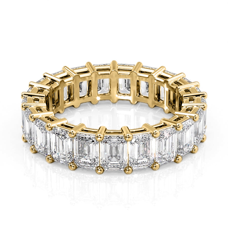 6ct Emerald Eternity. A Yellow Gold Eternity Ring Set With 6tcw Emerald Lab Grown Diamonds. White Background.