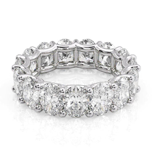 7.5ct Oval U Prong Eternity. A White Gold Eternity Ring Set With 7.5tcw Oval Lab Grown Diamonds. White Background.