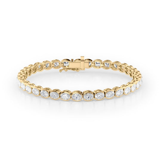 8ct East West Half Bezel Oval Tennis Bracelet. A Yellow Gold Tennis Bracelet Set With 8tcw Oval Lab Grown Diamonds. White Background.