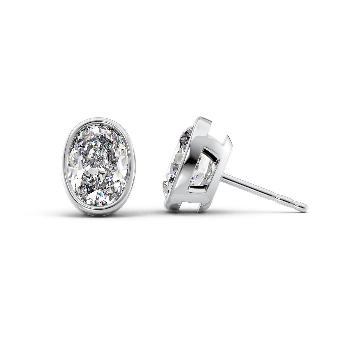 Bezel Stud Earrings Set With Oval Lab Diamonds. A White Gold Diamond Stud Earrings Set With A 1ct Oval Lab Diamond. White Background.