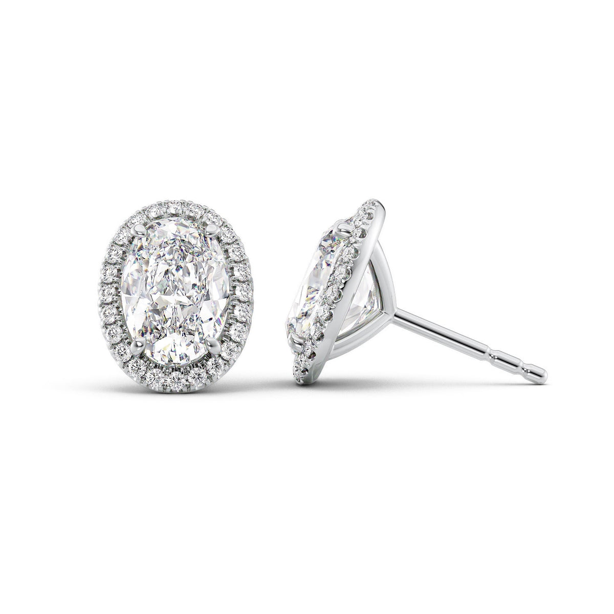 Halo Stud Earrings Set With Oval Lab Diamonds. A White Gold Diamond Stud Earrings Set With A 4ct Oval Lab Diamond. White Background.