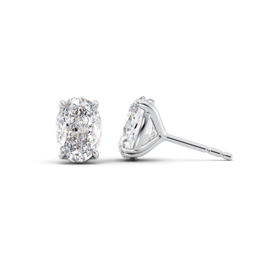 Stud Earrings Set With Oval Lab Diamonds. A White Gold Diamond Stud Earrings Set With A 1ct Oval Lab Diamond. White Background.