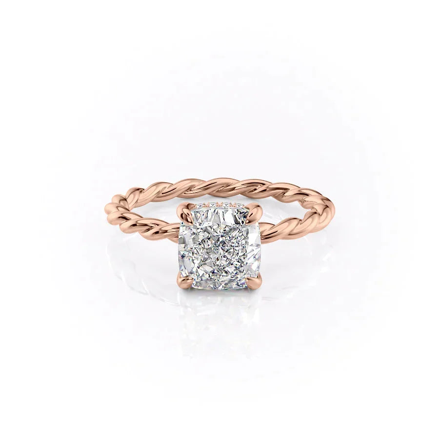 The Alice. A Rose Gold Solitaire, Hidden Halo Engagement Ring Set With A 2ct Cushion Lab Grown Diamond. White Background.