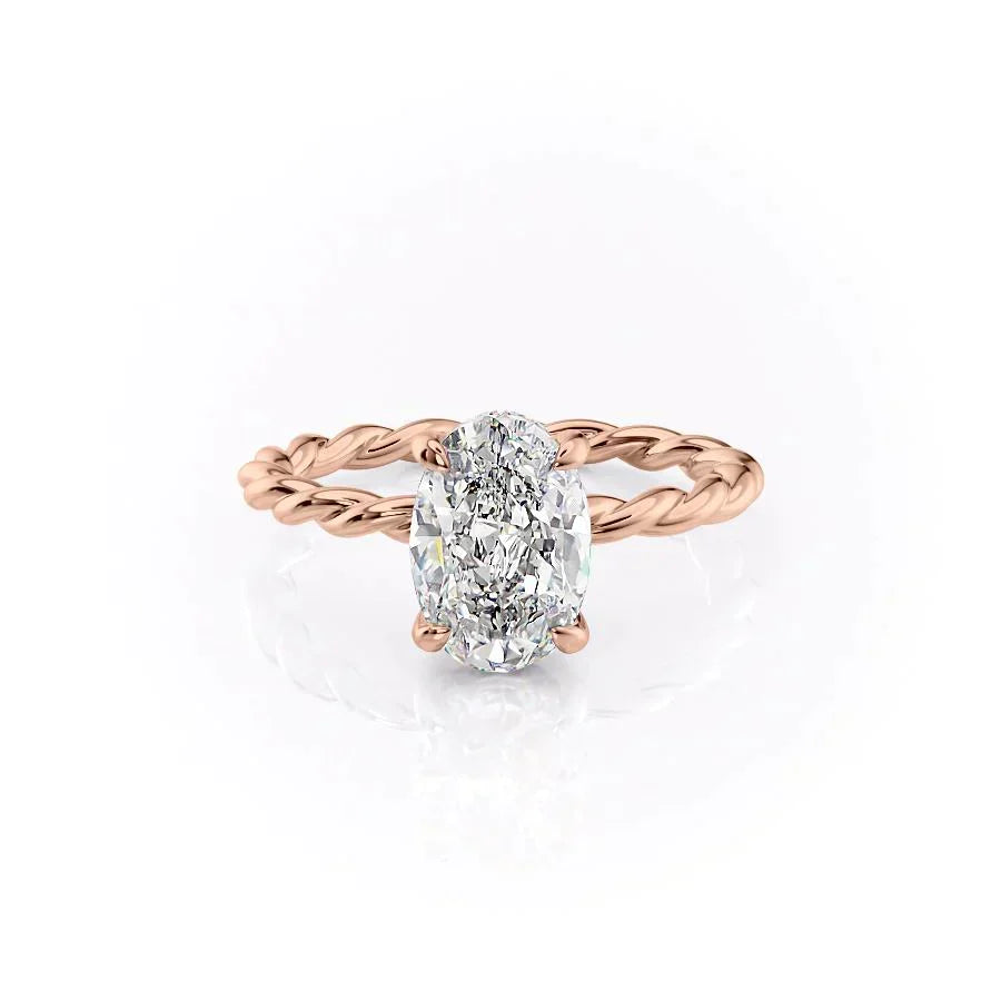 The Alice. A Rose Gold Solitaire, Hidden Halo Engagement Ring Set With A 2ct Oval Lab Grown Diamond. White Background.