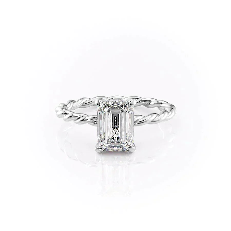 The Alice. A White Gold Solitaire, Hidden Halo Engagement Ring Set With A 2ct Emerald Lab Grown Diamond. White Background.