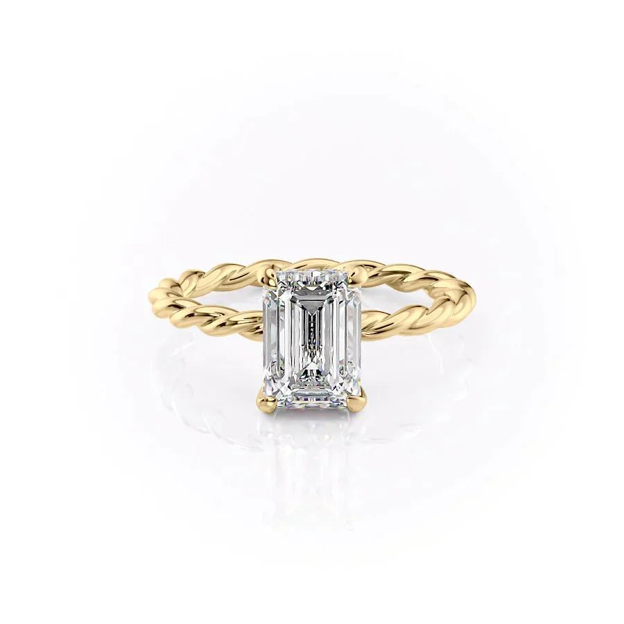 The Alice. A Yellow Gold Solitaire, Hidden Halo Engagement Ring Set With A 2ct Emerald Lab Grown Diamond. White Background.