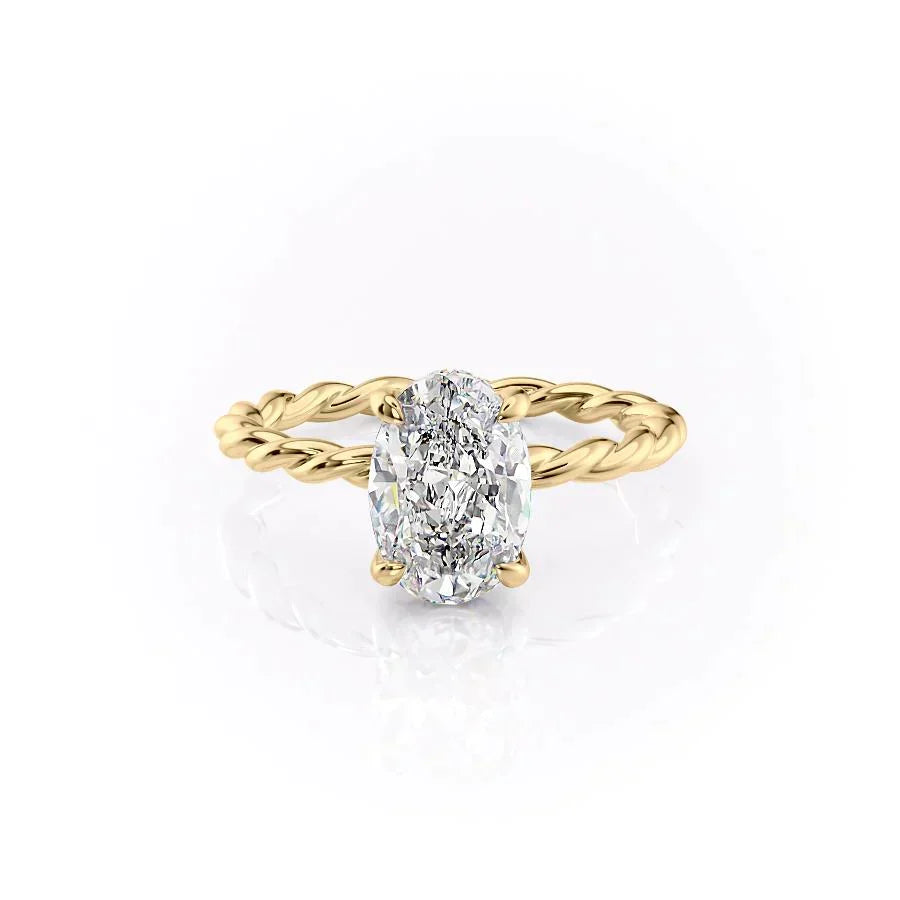 The Alice. A Yellow Gold Solitaire, Hidden Halo Engagement Ring Set With A 2ct Oval Lab Grown Diamond. White Background.