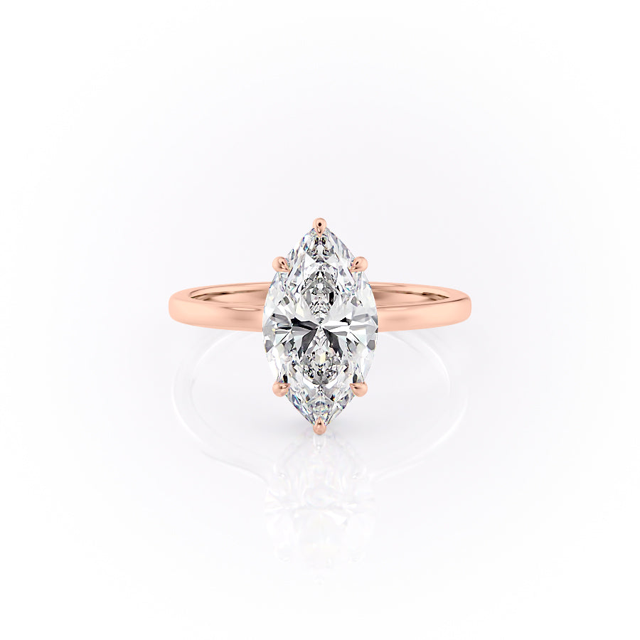 The Aline. A Rose Gold Solitaire, Hidden Halo Engagement Ring Set With A 2ct Marquise Lab Grown Diamond. White Background.