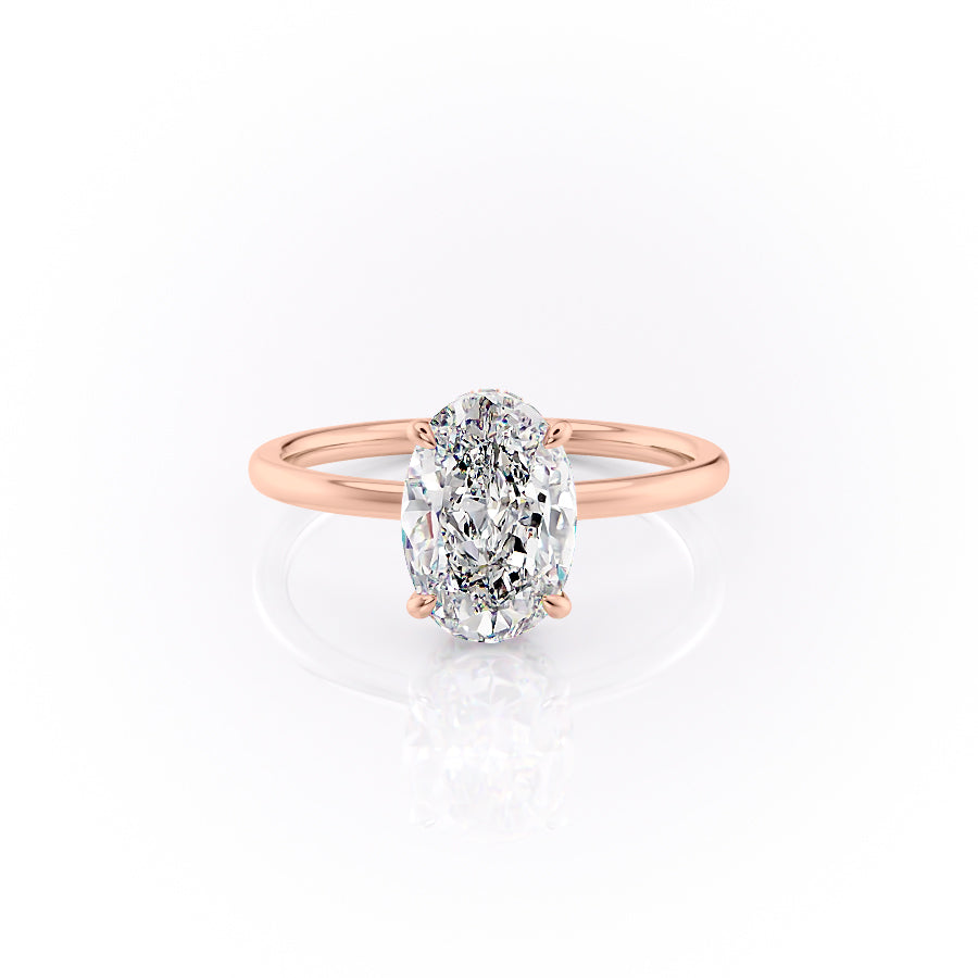 The Aline. A Rose Gold Solitaire, Hidden Halo Engagement Ring Set With A 2ct Oval Lab Grown Diamond. White Background.