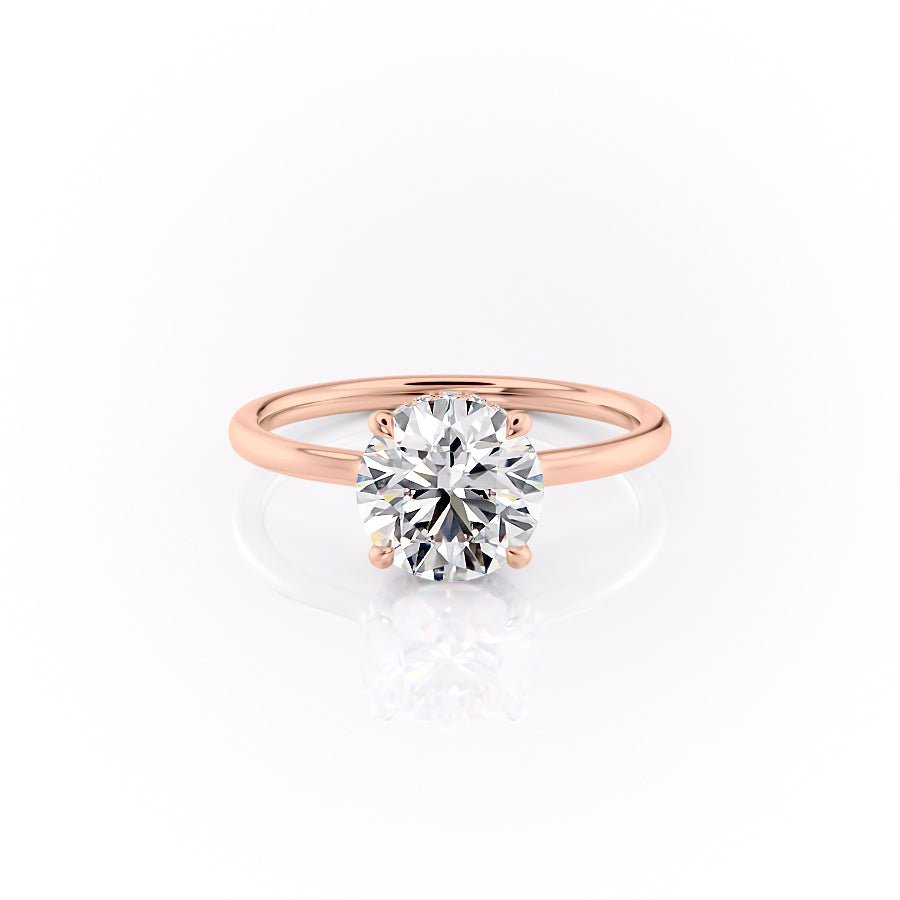 The Aline. A Rose Gold Solitaire, Hidden Halo Engagement Ring Set With A 2ct Round Lab Grown Diamond. White Background.
