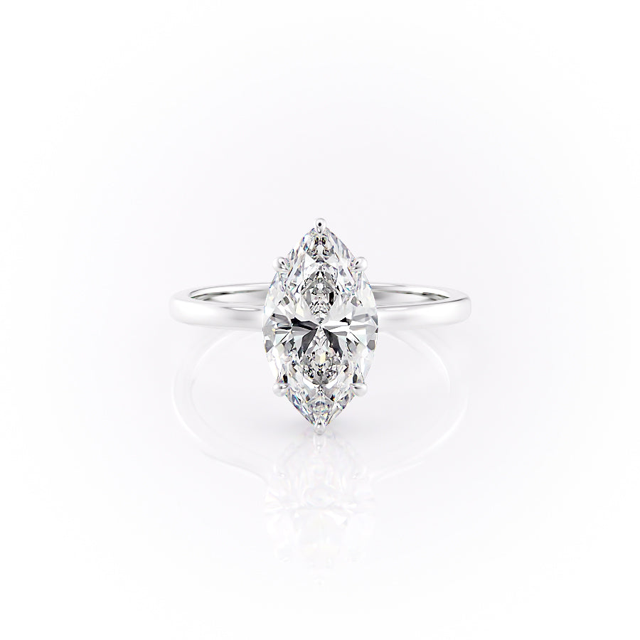 The Aline. A White Gold Solitaire, Hidden Halo Engagement Ring Set With A 2ct Marquise Lab Grown Diamond. White Background.