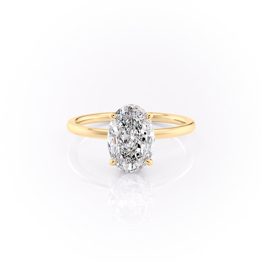 The Aline. A Yellow Gold Solitaire, Hidden Halo Engagement Ring Set With A 2ct Oval Lab Grown Diamond. White Background.