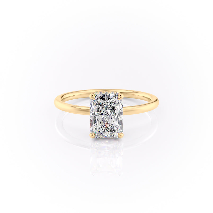 The Aline. A Yellow Gold Solitaire, Hidden Halo Engagement Ring Set With A 2ct Radiant Lab Grown Diamond. White Background.