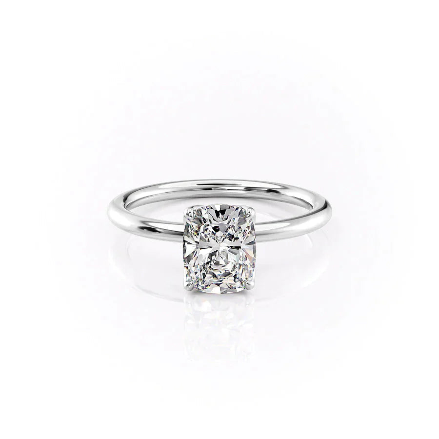 The Alison. A White Gold Solitaire Engagement Ring Set With A 2ct Elongated Cushion Lab Grown Diamond. White Background.