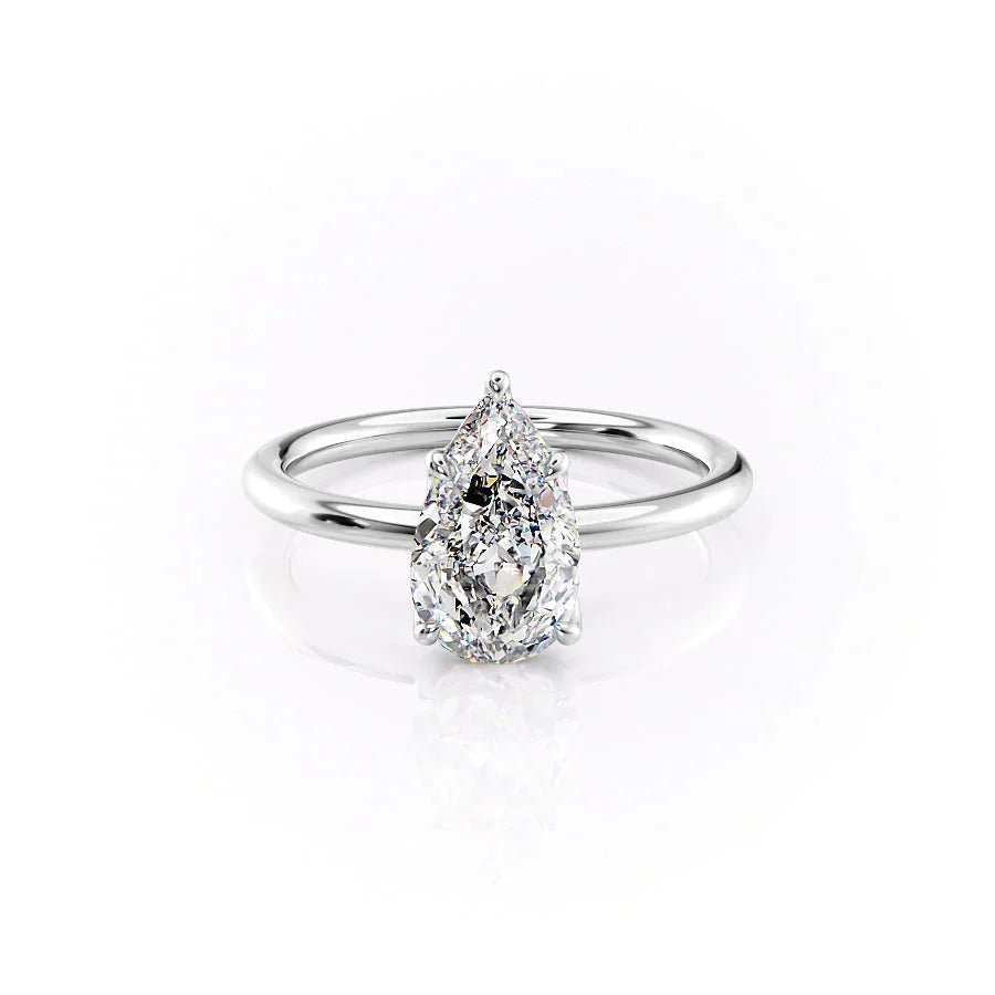 The Alison. A White Gold Solitaire Engagement Ring Set With A 2ct Pear Lab Grown Diamond. White Background.