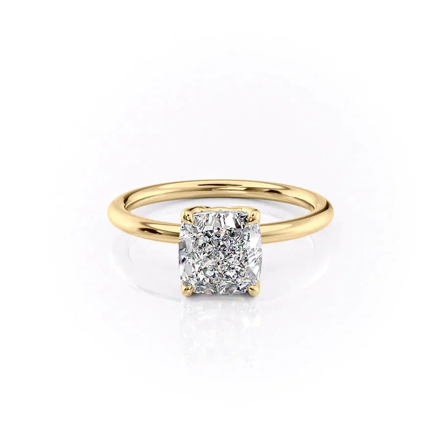 The Alison. A Yellow Gold Solitaire Engagement Ring Set With A 2ct Cushion Lab Grown Diamond. White Background.