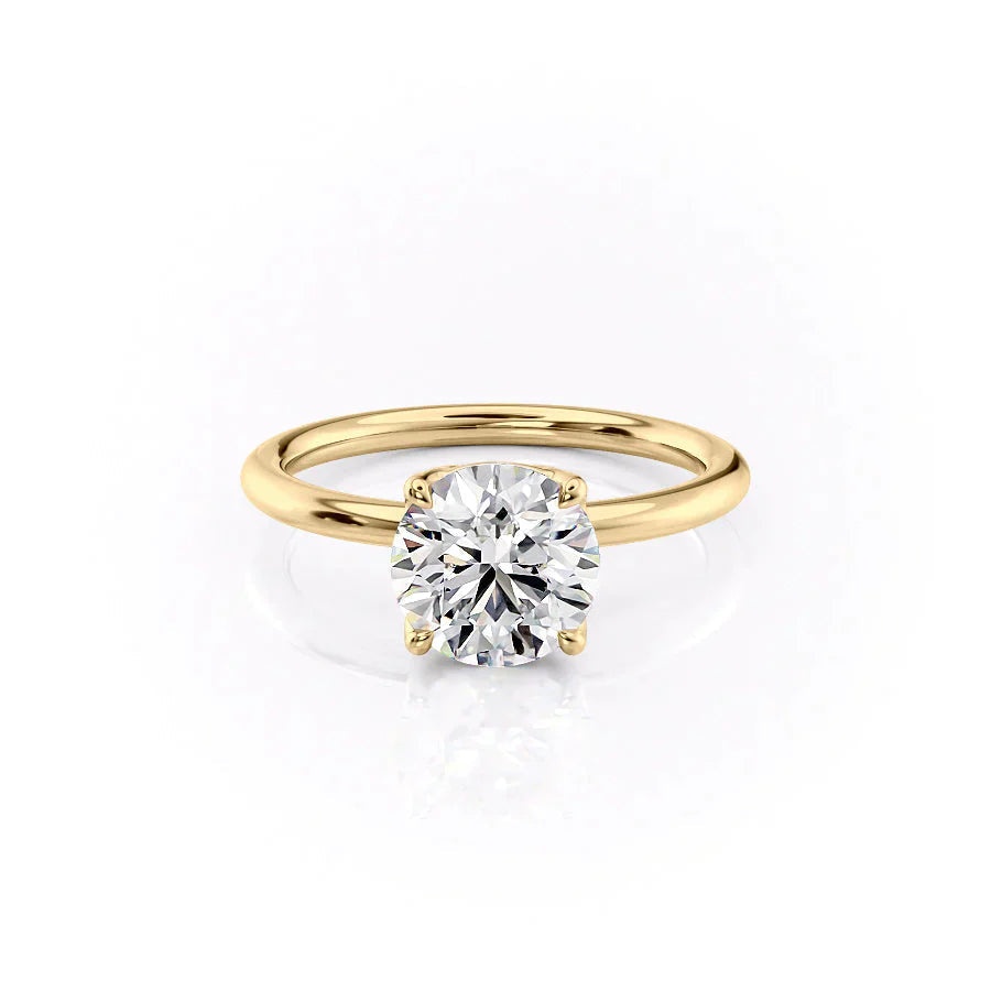 The Alison. A Yellow Gold Solitaire Engagement Ring Set With A 2ct Round Lab Grown Diamond. White Background.