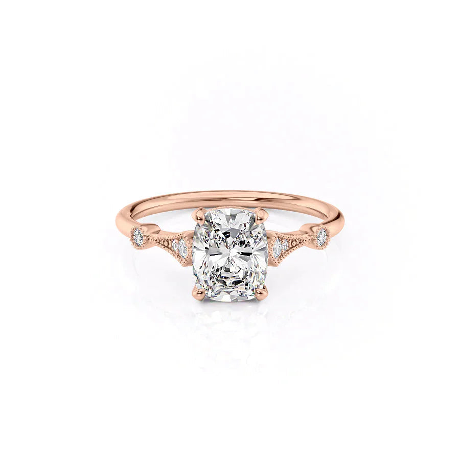 The Amber. A Rose Gold Vintage, Side Stones Engagement Ring Set With A 2ct Elongated Cushion Lab Grown Diamond. White Background.