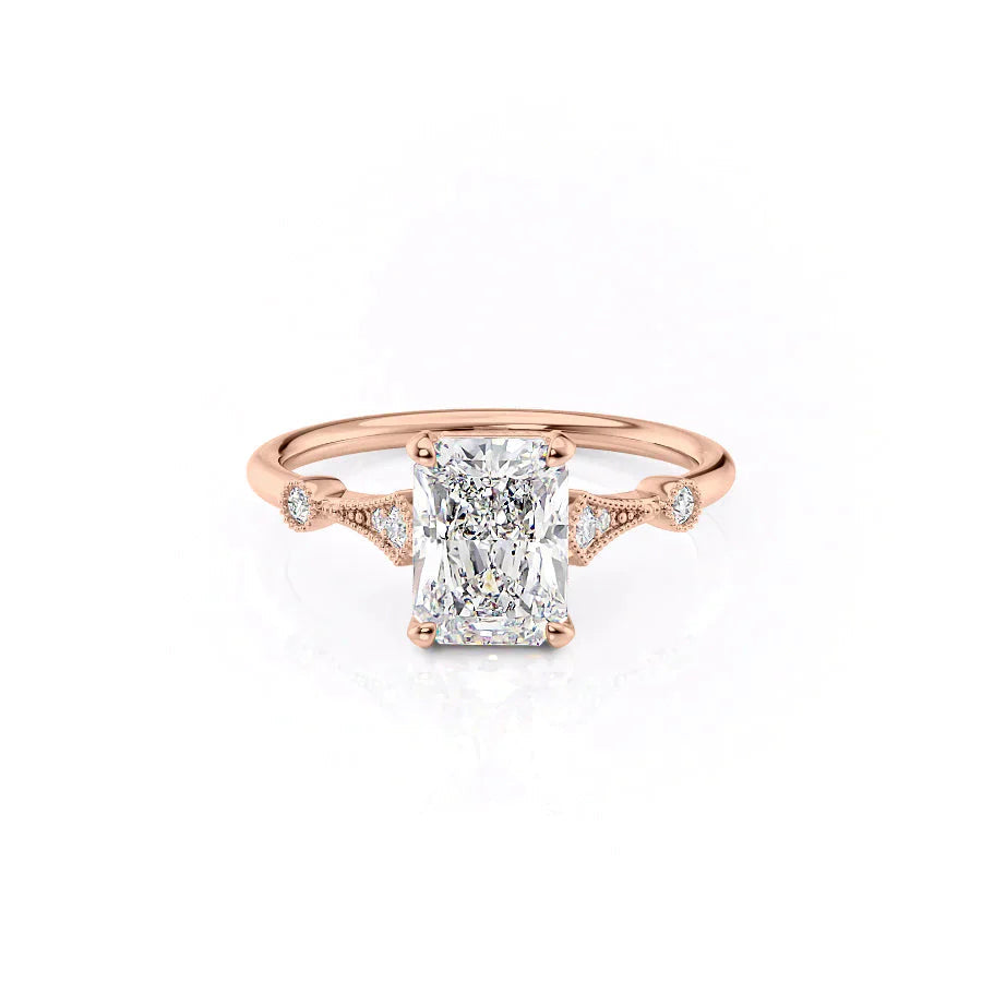 The Amber. A Rose Gold Vintage, Side Stones Engagement Ring Set With A 2ct Radiant Lab Grown Diamond. White Background.