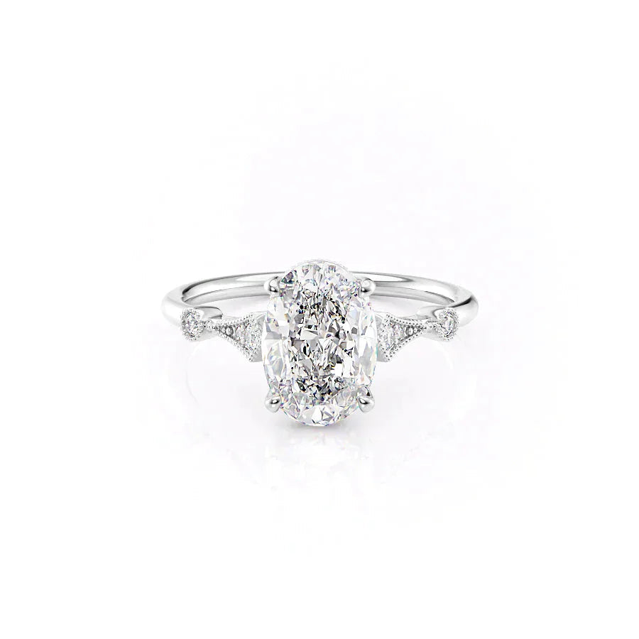 The Amber. A White Gold Vintage, Side Stones Engagement Ring Set With A 2ct Oval Lab Grown Diamond. White Background.