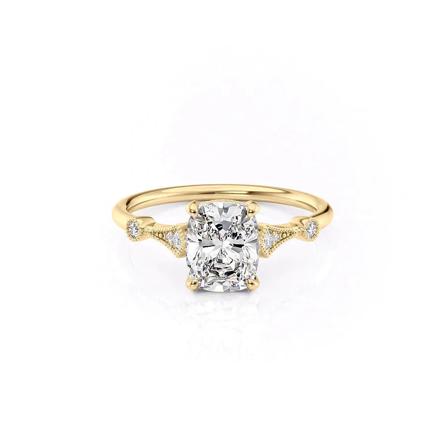 The Amber. A Yellow Gold Vintage, Side Stones Engagement Ring Set With A 2ct Elongated Cushion Lab Grown Diamond. White Background.