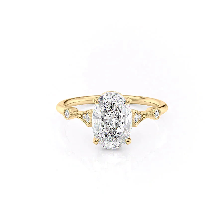 The Amber. A Yellow Gold Vintage, Side Stones Engagement Ring Set With A 2ct Oval Lab Grown Diamond. White Background.