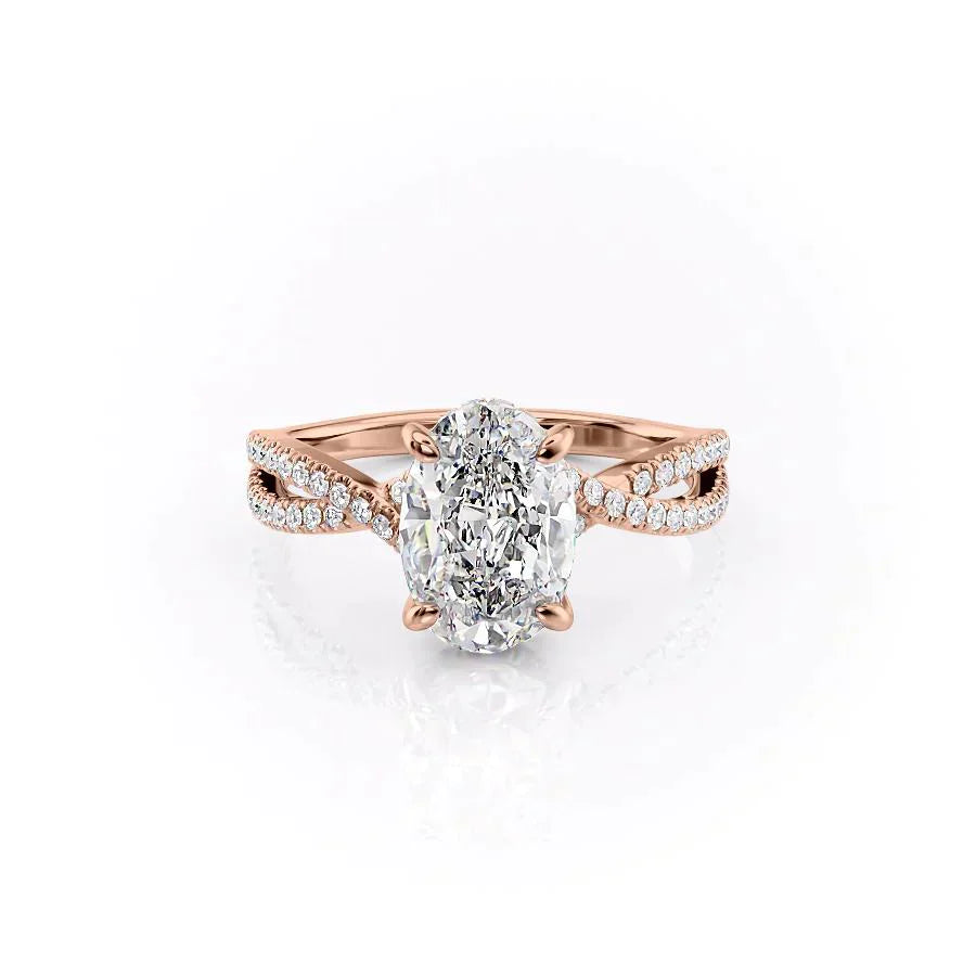 The Angelina. A Rose Gold Pave, Hidden Halo Engagement Ring Set With A 2ct Oval Lab Grown Diamond. White Background.
