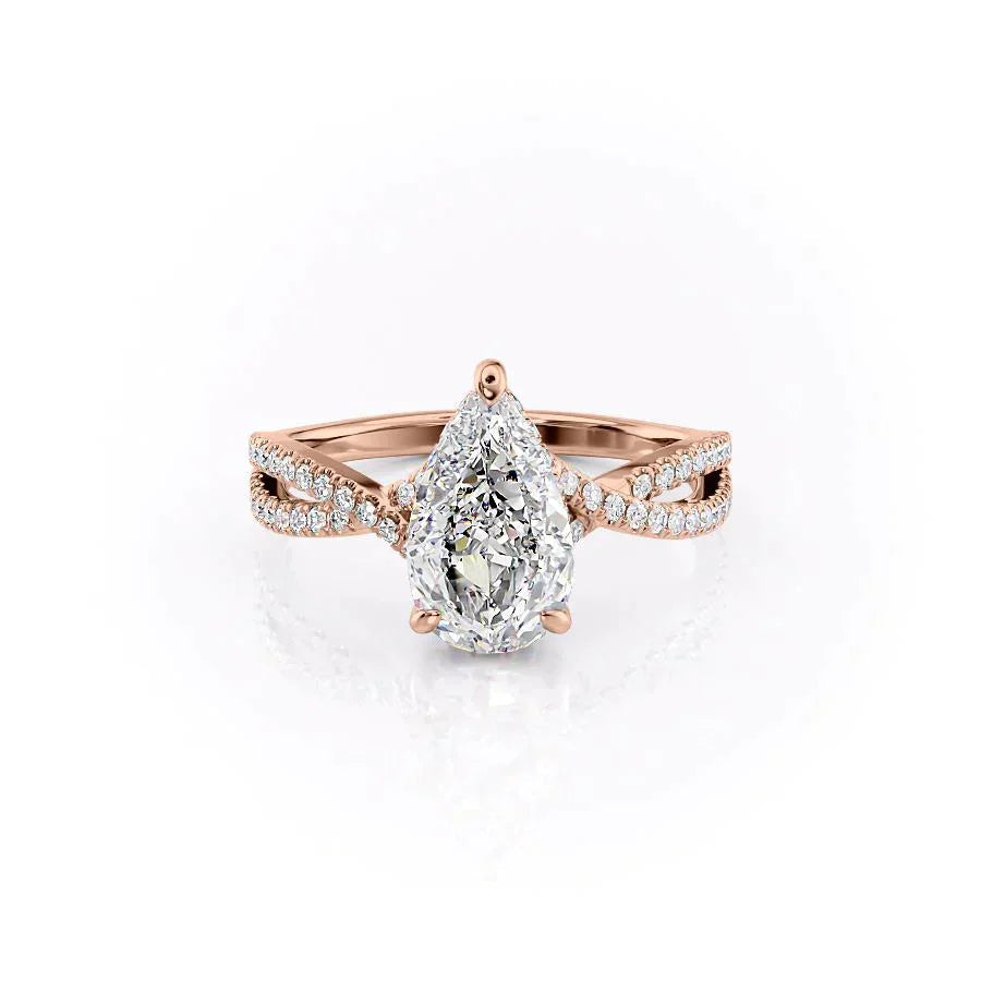 The Angelina. A Rose Gold Pave, Hidden Halo Engagement Ring Set With A 2ct Pear Lab Grown Diamond. White Background.