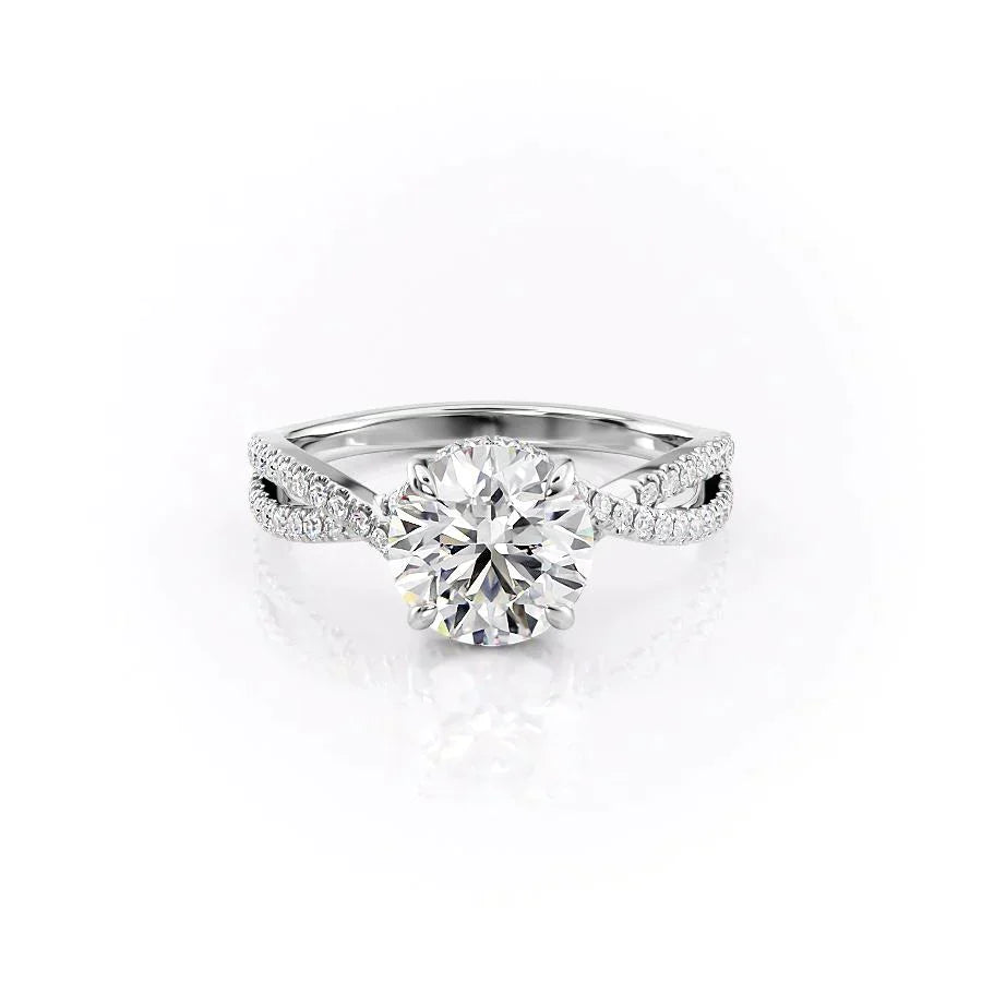 The Angelina. A White Gold Pave, Hidden Halo Engagement Ring Set With A 2ct Round Lab Grown Diamond. White Background.