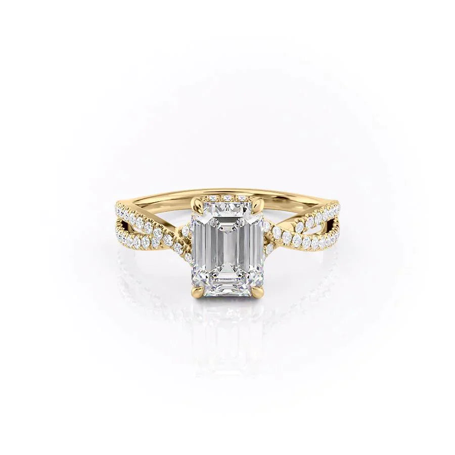 The Angelina. A Yellow Gold Pave, Hidden Halo Engagement Ring Set With A 2ct Emerald Lab Grown Diamond. White Background.