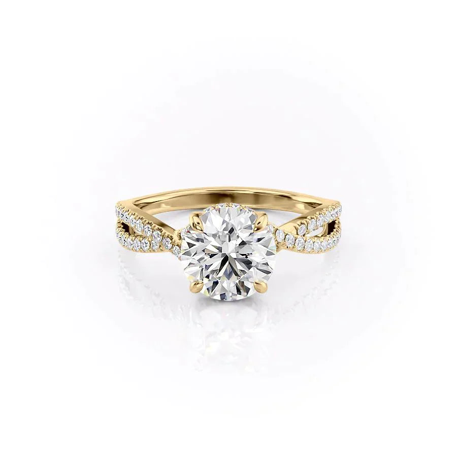 The Angelina. A Yellow Gold Pave, Hidden Halo Engagement Ring Set With A 2ct Round Lab Grown Diamond. White Background.