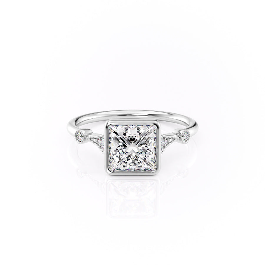 The Bezel Amber. A White Gold Vintage, Side Stones Engagement Ring Set With A 2ct Princess Lab Grown Diamond. White Background.