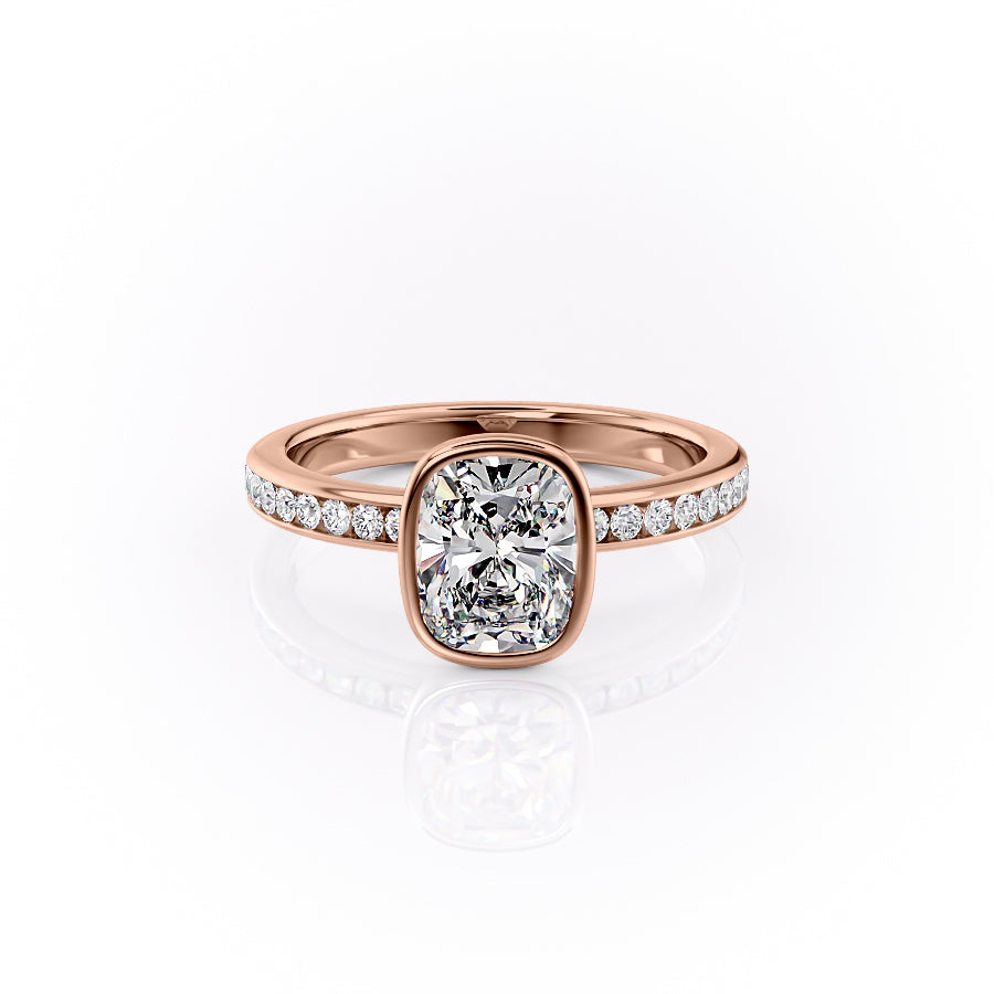 The Bezel Marilyn. A Rose Gold Channel-Set, Side Stones Engagement Ring Set With A 2ct Elongated Cushion Lab Grown Diamond. White Background.