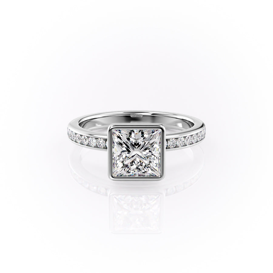 The Bezel Marilyn. A White Gold Channel-Set, Side Stones Engagement Ring Set With A 2ct Princess Lab Grown Diamond. White Background.