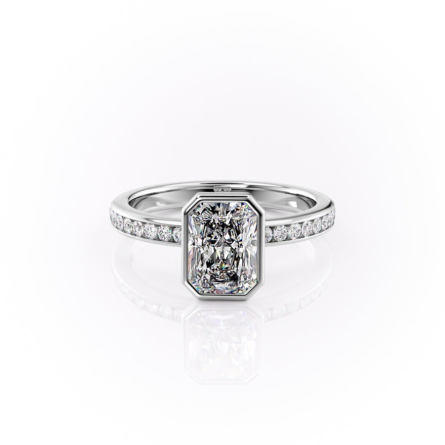 The Bezel Marilyn. A White Gold Channel-Set, Side Stones Engagement Ring Set With A 2ct Radiant Lab Grown Diamond. White Background.