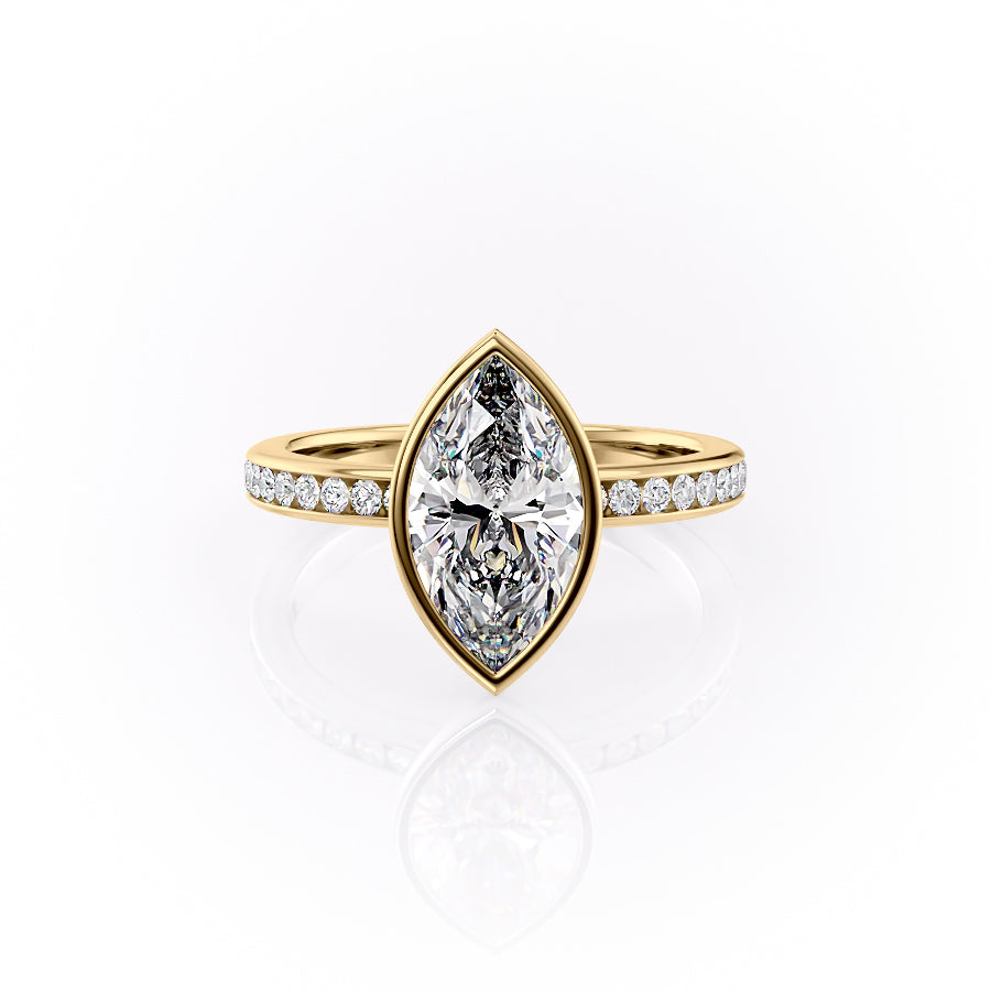 The Bezel Marilyn. A Yellow Gold Channel-Set, Side Stones Engagement Ring Set With A 2ct Marquise Lab Grown Diamond. White Background.