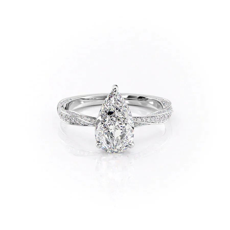 The Caroline. A White Gold Pave, Hidden Halo Engagement Ring Set With A 2ct Pear Lab Grown Diamond. White Background.