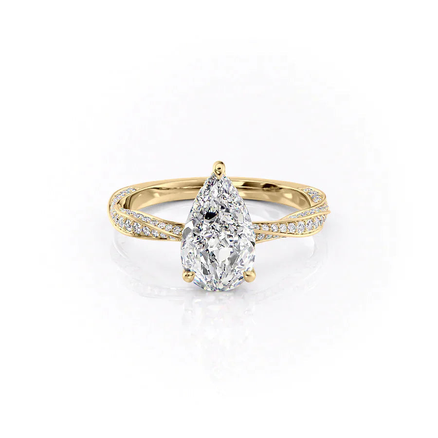 The Caroline. A Yellow Gold Pave, Hidden Halo Engagement Ring Set With A 2ct Pear Lab Grown Diamond. White Background.