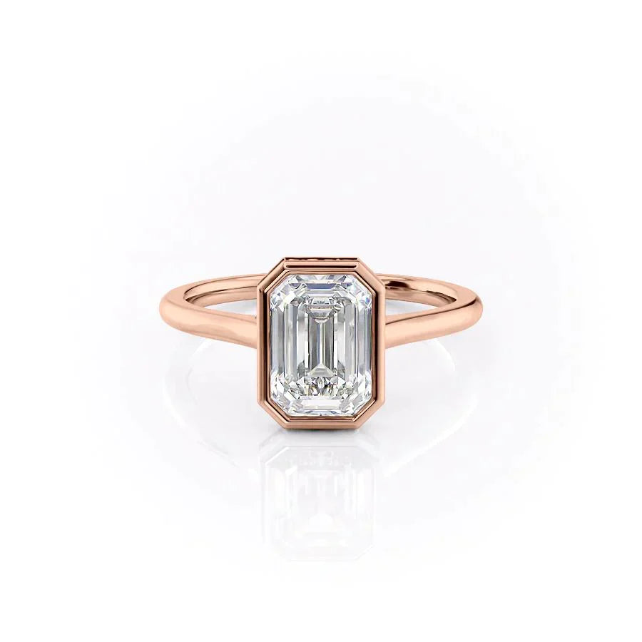 The Charlotte. A Rose Gold Vintage, Solitaire, Hidden Halo, Bezel Engagement Ring Set With A 2ct Emerald Lab Grown Diamond. White Background.