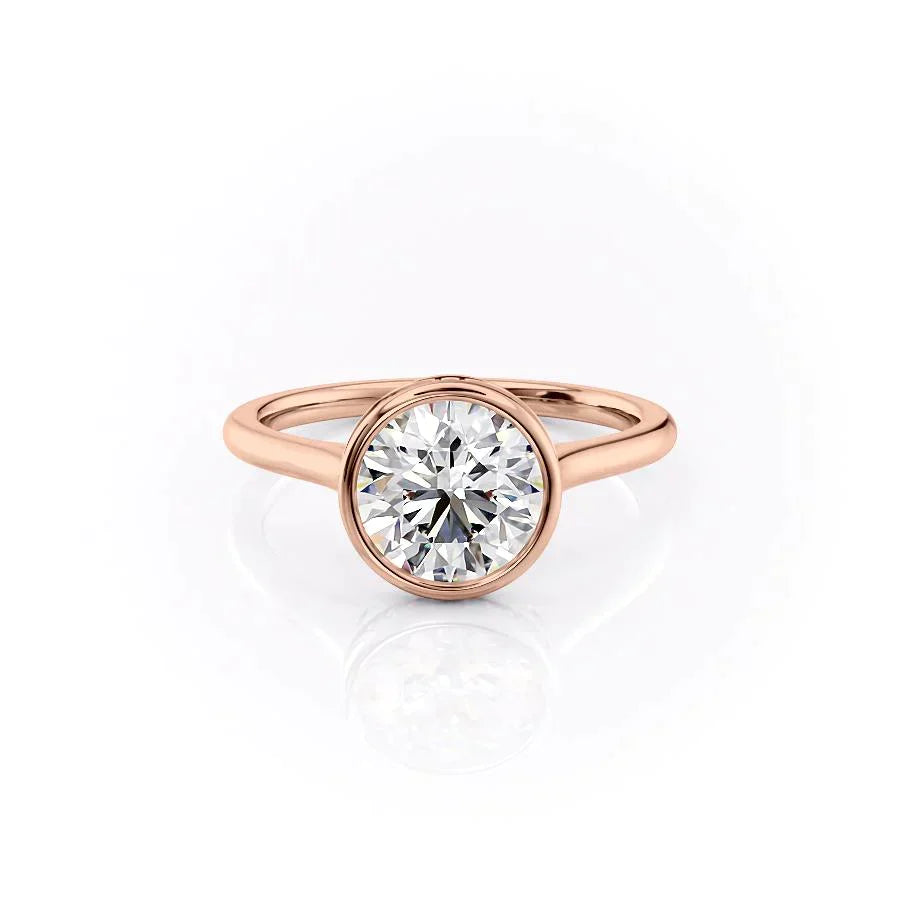 The Charlotte. A Rose Gold Vintage, Solitaire, Hidden Halo, Bezel Engagement Ring Set With A 2ct Round Lab Grown Diamond. White Background.