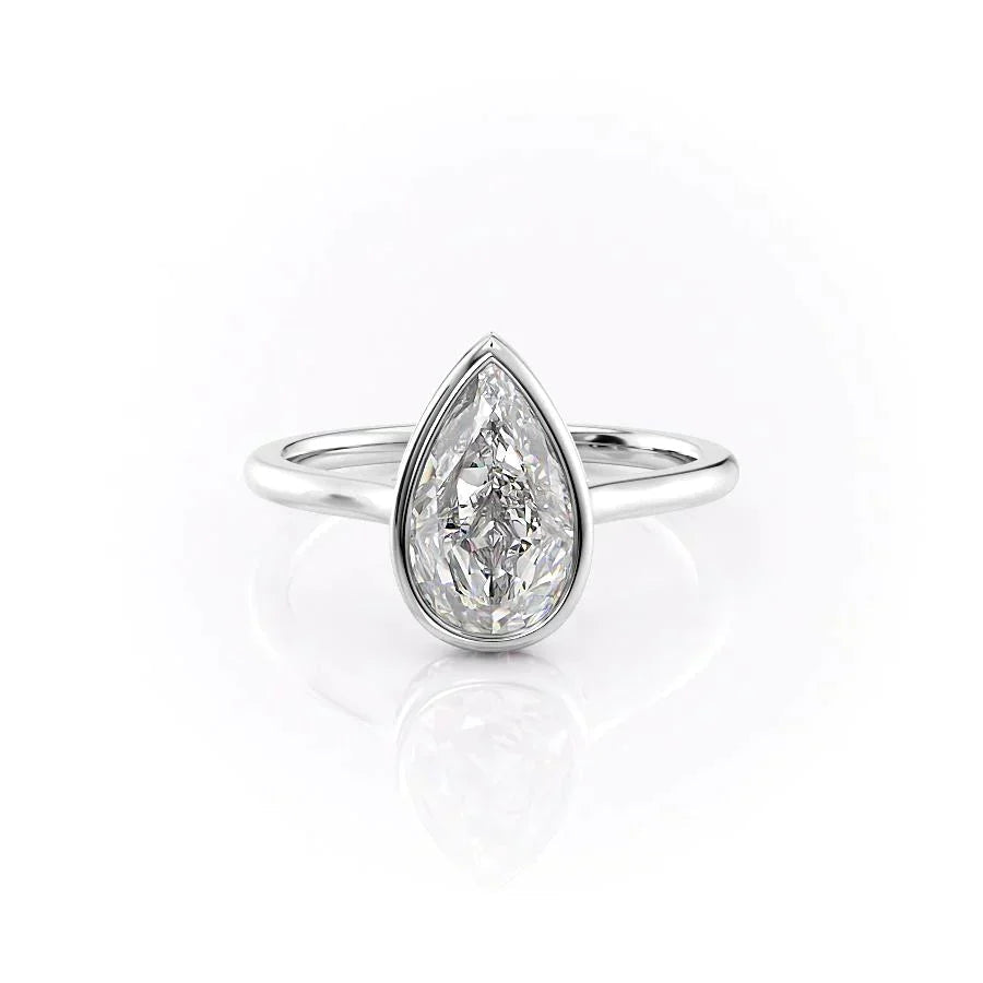 The Charlotte. A White Gold Vintage, Solitaire, Hidden Halo, Bezel Engagement Ring Set With A 2ct Pear Lab Grown Diamond. White Background.