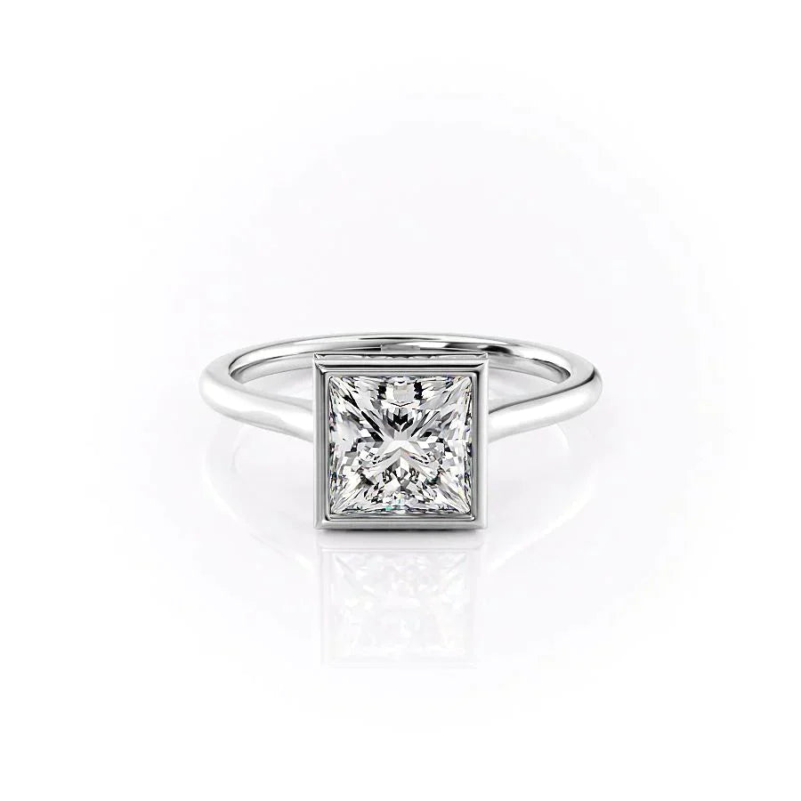 The Charlotte. A White Gold Vintage, Solitaire, Hidden Halo, Bezel Engagement Ring Set With A 2ct Princess Lab Grown Diamond. White Background.